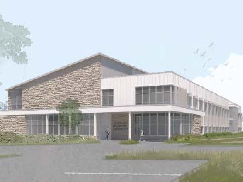 rendering of modern lab facility, trees, grass