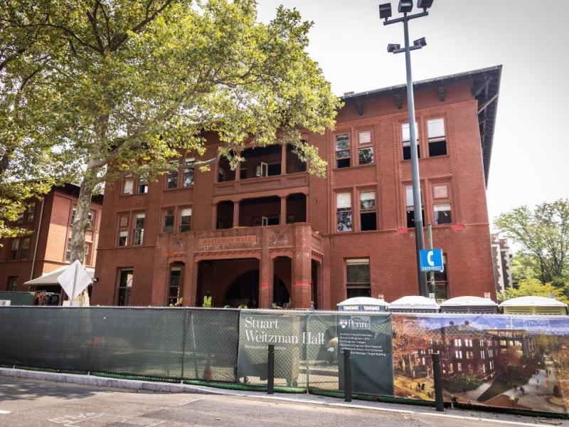 Street view of red brick Weitzman Hall under construction 