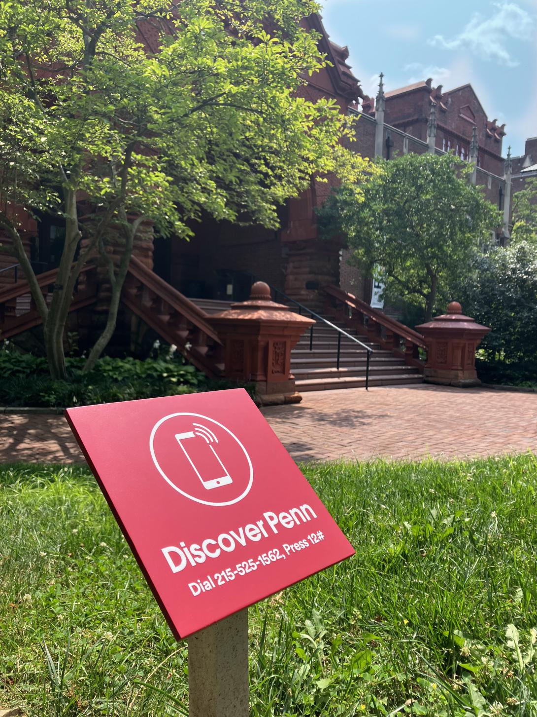 Front steps of Fisher Fine Arts library with red Discover Penn sign
