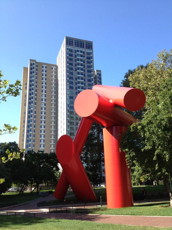 View of giant red sculpture made of conical shapes on Penn's campus