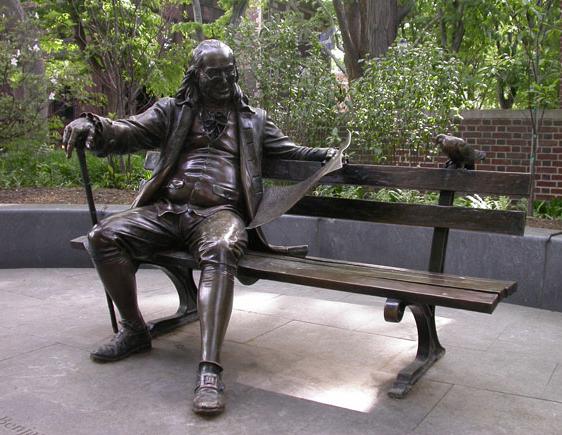 Ben Franklin statue sitting on a park bench
