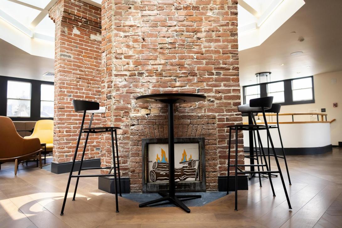 brick fireplaces in the interior of the quad