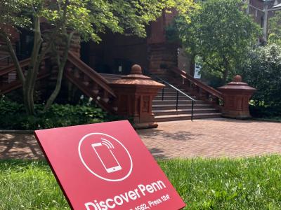 Front steps of Fisher Fine Arts library with red Discover Penn sign