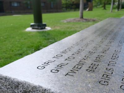 Engraved stone along brick walkway on upenn's campus.