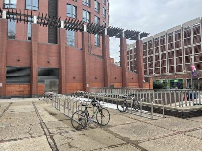Image of bike corral and parked bikes outside of solomon building