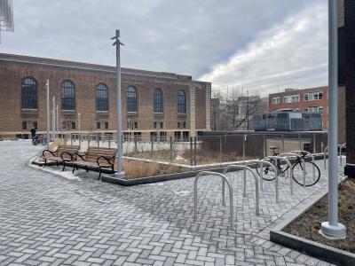 View of bike corral, buildings, and sky