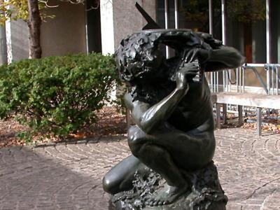 Pan With Sundial kneeling statue