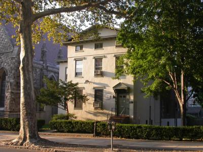 Greenfield Intercultural Center framed by trees