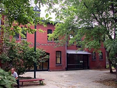 the brick facade of the Carriage House LGBT Center entrance