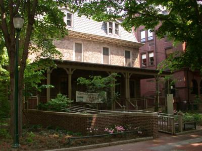 Locust House framed by trees