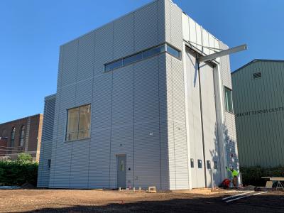 Photo of exterior of high bay substantially complete