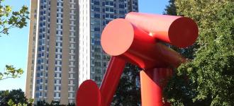 View of giant red sculpture made of conical shapes on Penn's campus